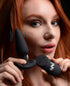 Adult model showcasing a vibrating silicone butt plug with remote, emphasizing its design and features.