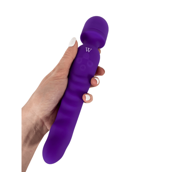 Purple flexible wand vibrator held in hand, designed for versatile pleasure with dual function and intelligent heating.